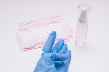Protective mask, disinfectants and gloves. Hygiene concept. prevent the spread of germs and...