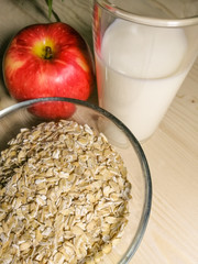 bowl of cereal with milk and apple