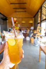 close up, a glass of lemon tea at store. Lifestyle