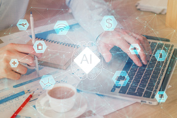 Double exposure of data internet theme hologram with man working on computer on background. Concept of innovation.