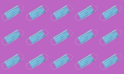 Pattern of medical protective masks on a pink background