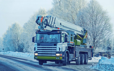 Lorry with lifting crane in road in winter Rovaniemi reflex