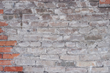 Old brick wall with cement lining. Rough brick walls. Cracked bricks. Background, material for design and modeling