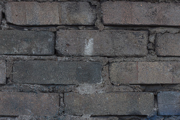 The texture of a cinder block wall. Close up. Material, surface, background for modeling, design, and decoration.
