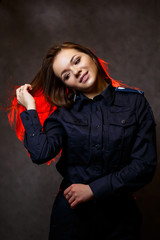 portrait of a beautiful girl in police uniform. Professional posing