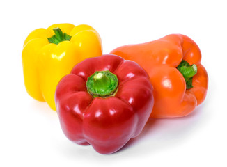Fresh bell peppers, isolated on white background. Red, orange and yellow bell peppers, cooking ingredients, healthy lifestyle.