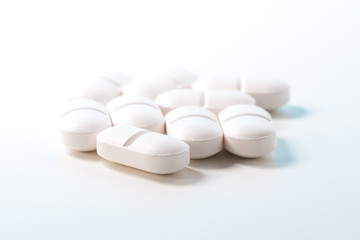 Fototapeta na wymiar Group of painkiller tablets on white