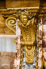 Fototapeta na wymiar Golden statue, luxury interior detail.