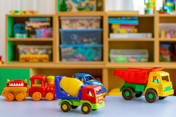 plastic toys are on the table of the car.educational toy constructor stands on a table in a kindergarten or at home