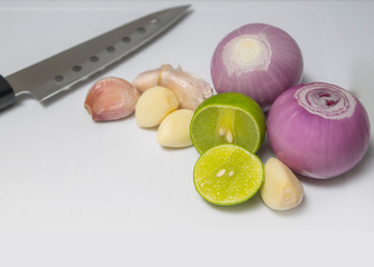 Set of bright vegetables around on white cutting board. Free space for text