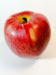 red, ripe, round Apple on a white background