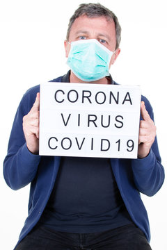 Portrait Handsome Man Wearing Medical Mask With Coronavirus Text Lightbox And White Background