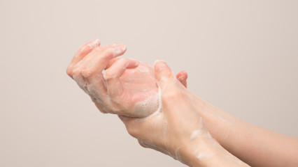 Fototapeta na wymiar Washing hands with soap for coronavirus prevention, hygiene to stop spreading coronavirus.