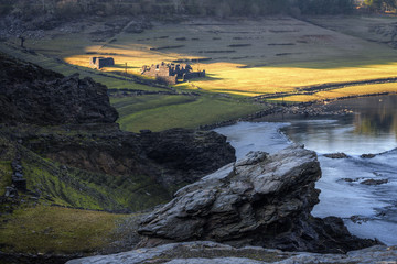 Remains of Old Houses Submerged in a Reservoir