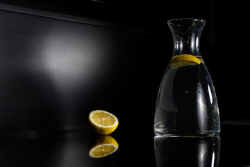 yellow lemon on a black mirror background