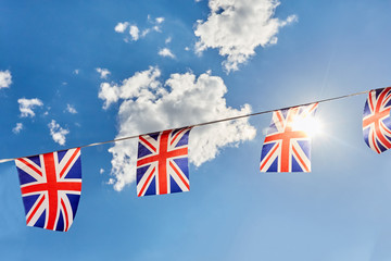 British Union Jack bunting flags against blue sky