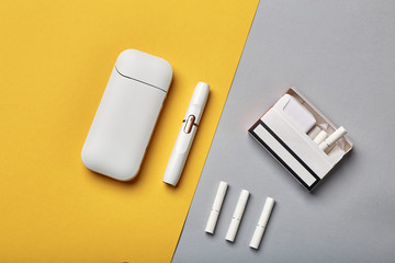 Electronic Cigarette Technology. Tobacco IQOS system. Close-up an electric hybrid cigarette with a heating pad. tobacco heating system. New tobacco heating system. Electronic cigarette mocap.