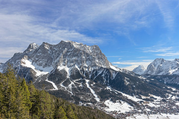 Fototapeta premium Zugspitze mountain and Ehrwald at sunny winter day. Tirol, Austria