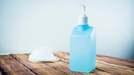 Medical surgical masks and hand sanitizer gel with alcohol for hands as hygiene corona virus protection and prevention. Shortage of medical protective supply during epidemic of respiratory disease