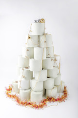 New Year tree made of toilet paper in 2021.   Concept: The most expensive toilet paper gift. Coronavirus has taken over the Earth,