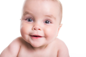 Sweet little girl on the floor of studio white background