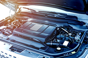 The powerful engine of a luxury car. Engine modern design. Car engine part details.