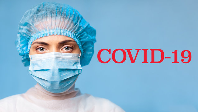 Portrait of a doctor woman in a medical uniform, wide image, closeup. Red caption title COVID-19. Novel Coronavirus (2019-nCoV).
