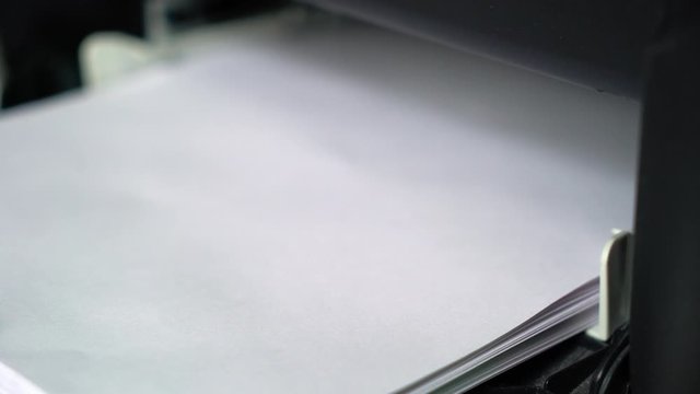 Printer printing documents or contracts in office, business concept