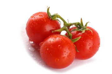 Red cherry tomatoes isolated on white