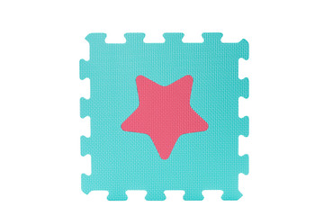 Macro photo of the details of a foam isolated on white background. Colored rubber mat puzzle for...