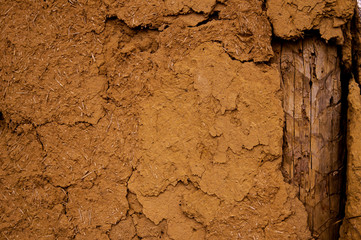 Old clay shack, wall with clay stucco. Texture, old stucco, vintage, clay wall.