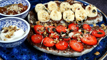 Waffles combined with Turkish delicacies are strawberries, bananas, honey, milk cream.