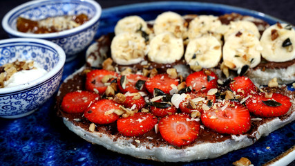 Waffles combined with Turkish delicacies are strawberries, bananas, honey, milk cream.