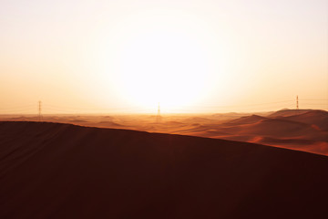 Fototapeta na wymiar Sunrise in the Arabian desert sand dunes of Riyadh, Saudi Arabia. Symbol of hope, new beginnings and bright future..