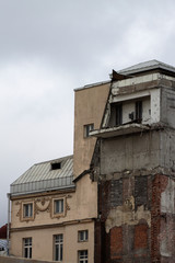 Fototapeta na wymiar half-demolished old building in the city