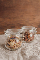 Salty and sweet granola in small glass jars.