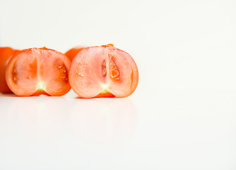 red ripe tomatoes on a white background