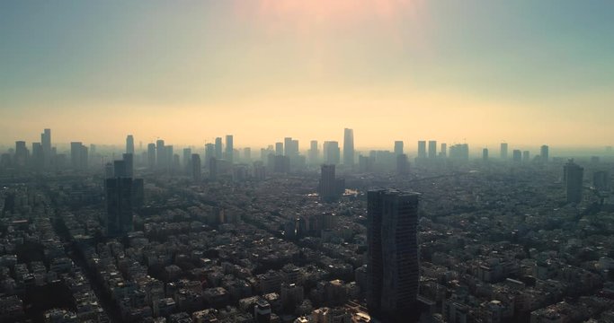 Israel skyline from a drone Early morning sunrise. Panoramic Aerial view above coastline of Tel Aviv modern and business city with hotels, seashore and beach. Middle east skylines