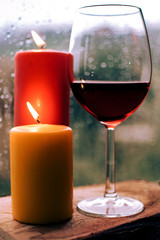 wine and candles in the rain