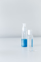 Set of face mask, soap bottle and disinfectant liquid.