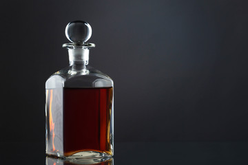 Bottle of whisky on gray
