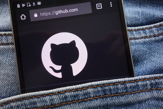 KONSKIE, POLAND - JUNE 09, 2018: GitHub website displayed on smartphone hidden in jeans pocket