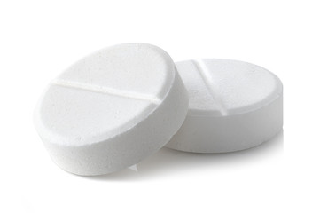 Close-up of two round paracetamol pills