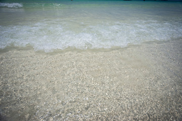 Colorful flip flops on the sandy beach