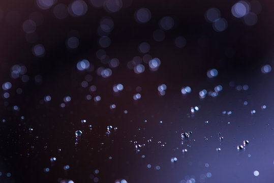 Closeup of a tablet screen with droplets on its surface after sneezing in the age of Coronavirus