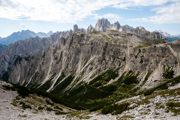 Fototapeta na wymiar Panorama of Dolomites mountains with clouds. National Park Tre Cime di Lavaredo, Alps mountain chain, Trentino Alto Adige region, Sudtirol, Italy