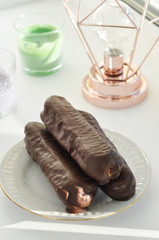 chocolate tasty eclaires on the plate