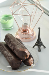 chocolate tasty eclaires on the plate