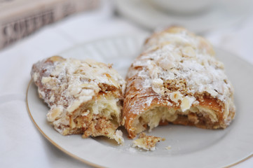 tasty fresh almond croissants on the plate