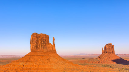 Fototapeta premium Beautiful sunset over famous Buttes of Monument Valley on the border between Arizona and Utah, USA